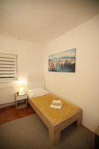 Postel nebo postele na pokoji v ubytování InOsijek- FEELS LIKE HOME