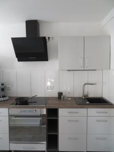 Kuchyň nebo kuchyňský kout v ubytování Ferienapartment Hugos + 2 fotografie