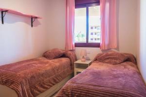 Un ou plusieurs lits dans un hébergement de l'établissement Apartamento La Cala de Mijas