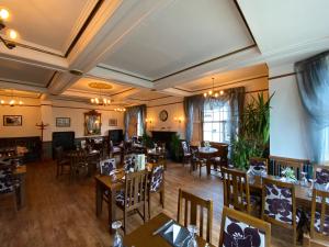 an overhead view of a restaurant with tables and chairs at The Hand Hotel Llangollen by Compass Hospitality in Llangollen +92 photos