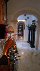 a motorcycle parked in a room with a hallway at Alandroal Guest House, Hotel in Alandroal