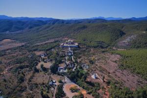 an aerial view of a house in the middle of a mountain at Banyan Tree Ringha in Shangri-La