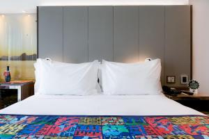 Llit o llits en una habitació de Arena Ipanema Hotel