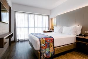 Llit o llits en una habitació de Arena Ipanema Hotel