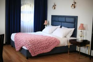 Letto o letti in una camera di OTAKHEBI