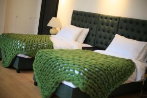Letto o letti in una camera di OTAKHEBI