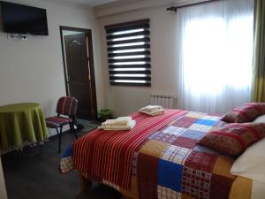 Ein Bett oder Betten in einem Zimmer der Unterkunft Hostal Bivouac