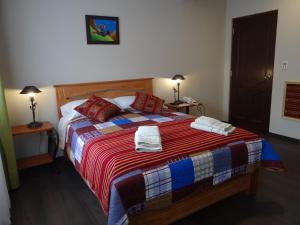 Ein Bett oder Betten in einem Zimmer der Unterkunft Hostal Bivouac
