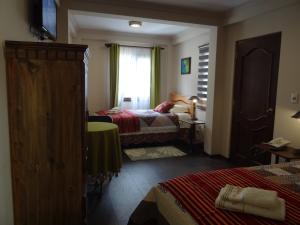 Ein Bett oder Betten in einem Zimmer der Unterkunft Hostal Bivouac