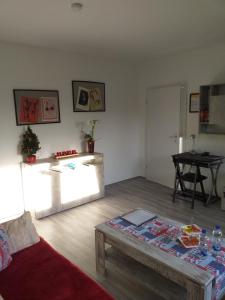 a living room with a couch and a table at Ferienwohnung Mabo in Kempen