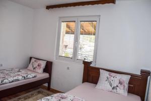 Postel nebo postele na pokoji v ubytování Ema Guest House
