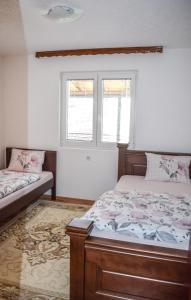 Postel nebo postele na pokoji v ubytování Ema Guest House