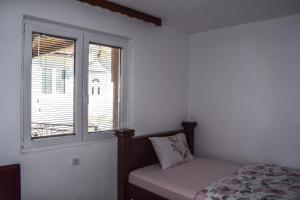 Postel nebo postele na pokoji v ubytování Ema Guest House