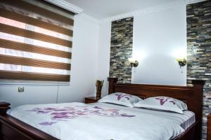 Postel nebo postele na pokoji v ubytování Ema Guest House