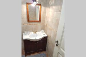 a bathroom with a sink and a mirror at Castle View Nest in Bled +11 photos