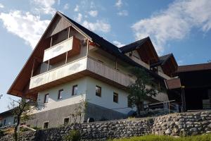 a house on top of a stone wall at Castle View Nest in Bled