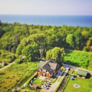 an aerial view of a house in the middle of a forest at KAPITAŃSKA 88 in Chłopy