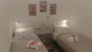 En eller flere senge i et værelse på La Casa di Alberto