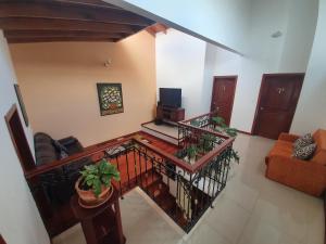 an overhead view of a living room with a balcony at Hotel Quinta de Santa Ana in Tibasosa