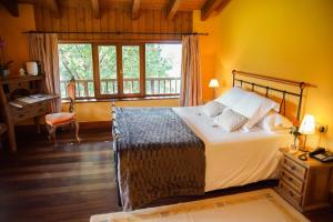 a bedroom with a bed and a desk and a window at Usategieta in Oiartzun +103 photos