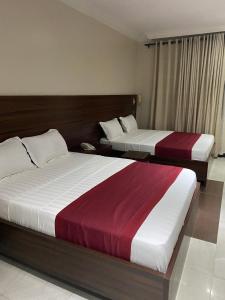 Letto o letti in una camera di Posh Hotel and Suites Victoria Island