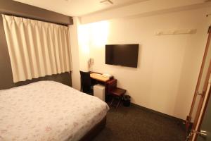 Katil atau katil-katil dalam bilik di Toyama Town Hotel