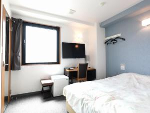 Katil atau katil-katil dalam bilik di Toyama Town Hotel