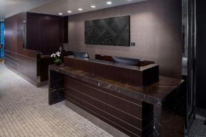 a bathroom with a brown counter with a sink at Park South Hotel, part of JdV by Hyatt in New York