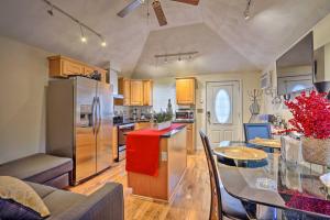 eine Küche mit einem Glastisch und einem Kühlschrank in der Unterkunft Charming Boston Area Home Less Than 1 Mi to Revere Beach! in Revere