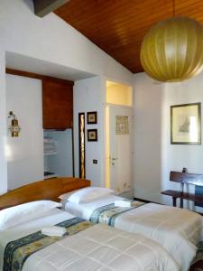 Postel nebo postele na pokoji v ubytování Bed and Breakfast Mimosa