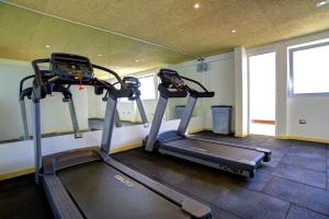a gym with two tread machines in a room at Mint Hotel in Arequipa