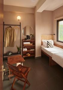 Postel nebo postele na pokoji v ubytování Minimalist Poshtel & Suites