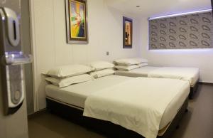 Katil atau katil-katil dalam bilik di M Design Hotel @ Pandan Indah