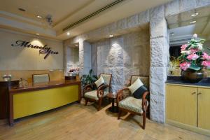 Ein Sitzbereich in der Unterkunft Miracle Grand Convention Hotel
