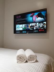 Postel nebo postele na pokoji v ubytování Radlett Residences Hotel - Tuguegarao