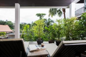 A restaurant or other place to eat at Kata gardens 2 bedroom near Kata beach 3B