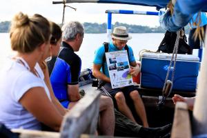 a group of people sitting on a boat on the water at Kitu Kiblu in Kilindoni +73 photos
