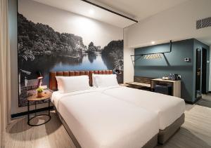 Postel nebo postele na pokoji v ubytování Travelodge Ipoh
