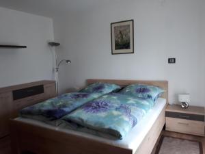 A bed or beds in a room at GRETL - Residence