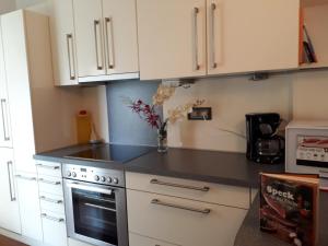 A kitchen or kitchenette at GRETL - Residence