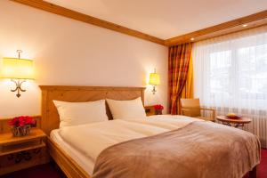 Postel nebo postele na pokoji v ubytování Hotel Holiday
