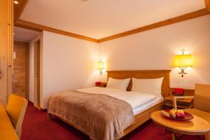 Postel nebo postele na pokoji v ubytování Hotel Holiday