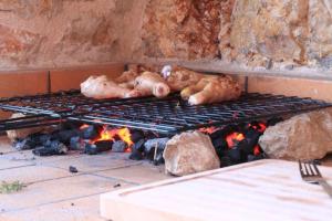 three chickens sleeping on top of a grill at Villa Koumaria in Sivota
