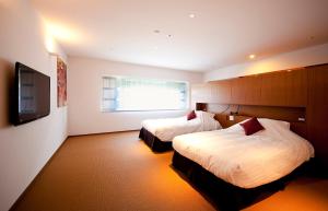 Letto o letti in una camera di Kinosaki Onsen Nishimuraya Hotel Shogetsutei