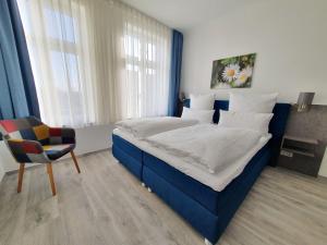Postel nebo postele na pokoji v ubytování Hotel Hanseat Stralsund