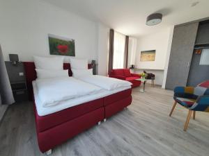 Postel nebo postele na pokoji v ubytování Hotel Hanseat Stralsund