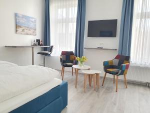 Postel nebo postele na pokoji v ubytování Hotel Hanseat Stralsund