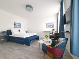 TV a/nebo společenská místnost v ubytování Hotel Hanseat Stralsund