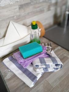 a table with a towel and a bottle of soap at Haus Strandburg Amrum in Wittdün