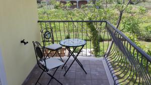 a balcony with a table and two chairs on a porch at Villa Marianna in Vasto